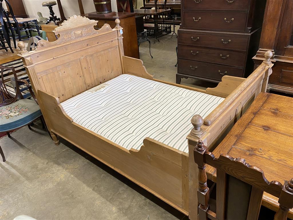 A 19th century Continental pine bed frame and mattress, width 130cm, length 190cm